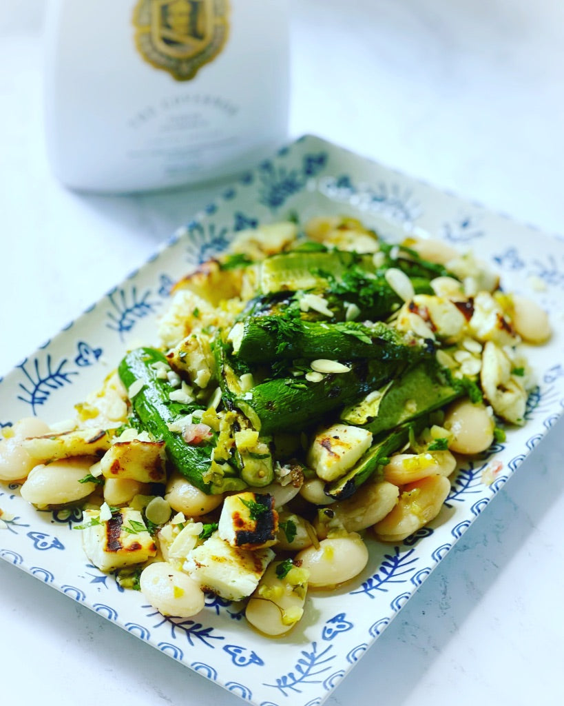 Grilled cucumber, butter beans and halloumi salad with a cornichon dre